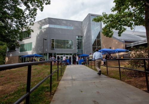 Owen Hall exterior with people gathered outside for an event